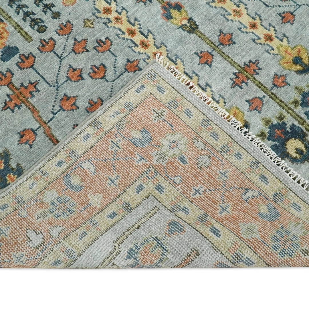 Close-up of a patterned rug with floral and geometric designs.